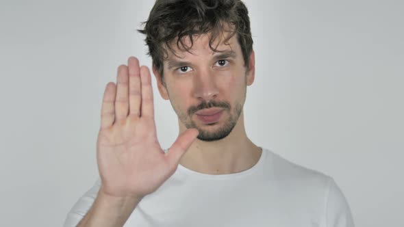 Stop Portrait of Young Casual Man Stopping with Hand