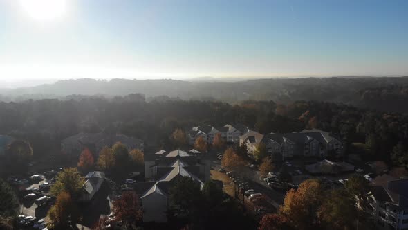 Apartment complex morning. Aerial descending. Establishing shot. Woodstock GA.
