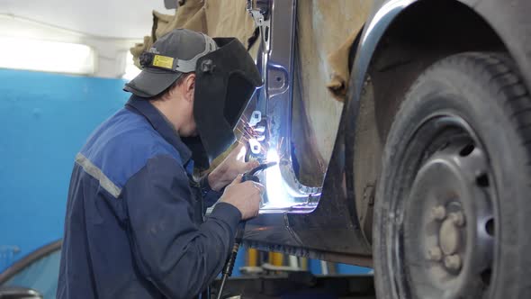 Worker Works with Welding