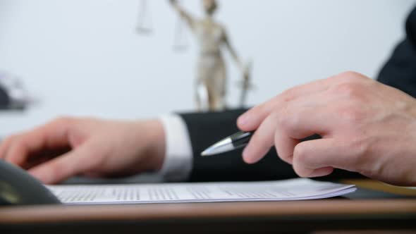 Lawyer Looks Through the Contract, Puts a Signature and Stamp. Office Work Concept. Hand Close-up