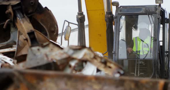 Male worker operating excavator machine 4k