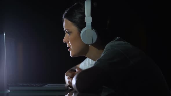 Upset Girl in Headset Looking at Laptop Screen, Error of Program, Virus Attack