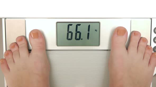 HD - Woman on weight scales