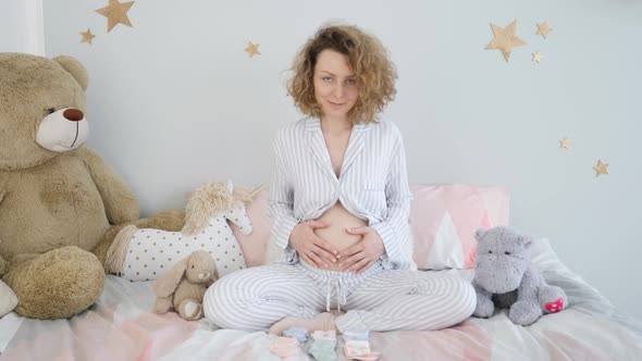 Portrait Of Happy Pregnant Woman Waiting For The Baby