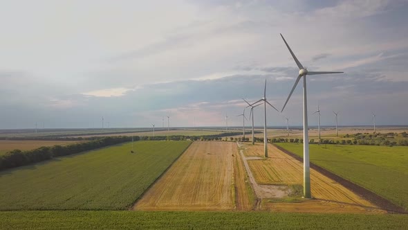 Aerial View of Wind Turbine Generators in Field Producing Clean Ecological Electricity