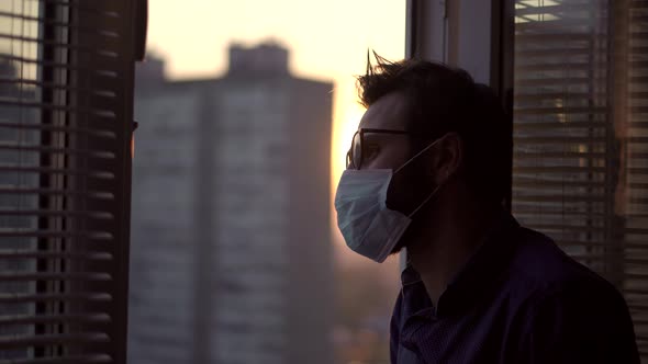 Sad Man In Face Mask Lockdown.Man In Face Mask In Quarantine Self Isolation Covid19 Coronavirus