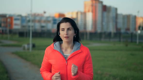 Fitness Young Woman Jogging in the City Park