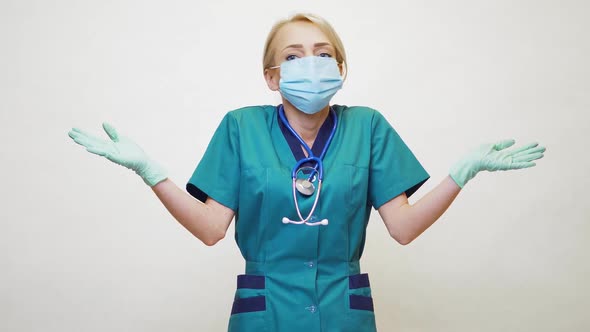 Medical Doctor Nurse Woman Wearing Protective Mask and Latex Gloves - Lack of Mind Gesture