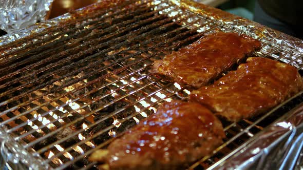 Close up Ribs with sauce on barbecue grill food night market, Bangkok