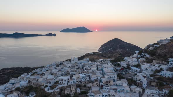 Aerial Hyper Lapse Moving Time Lapse Above Typicall Greek Village at Sunset on Milos, Greece Island