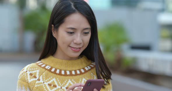 Woman use of cellphone in city