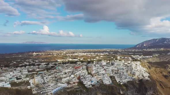 4k close aerial drone footage of santorini fira city town over caldera cliffs