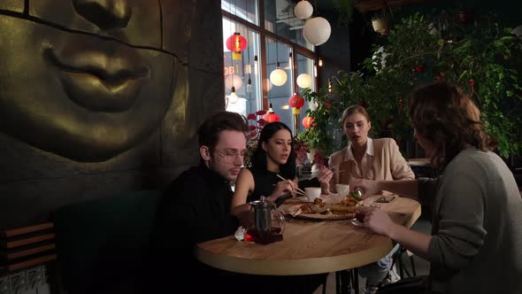 Group of Friends Relaxing in a Cafe