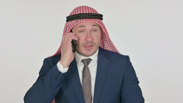 Arab Businessman Talking on Phone, White Background