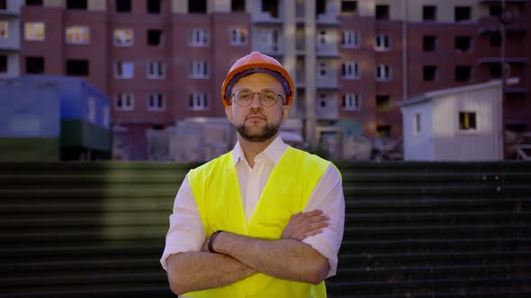 Young Worker with Black Beard and in Black Glasses Stand