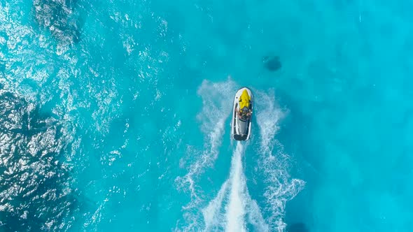 Aerial drone view of jetski personal watercraft in Bora Bora tropical island.