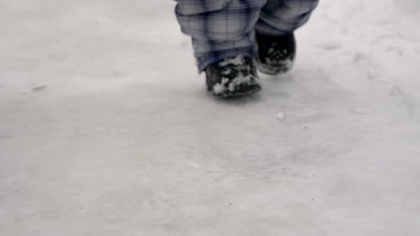 Mother Walks With Her Child In City. Snowy Winter Slow Motion 6