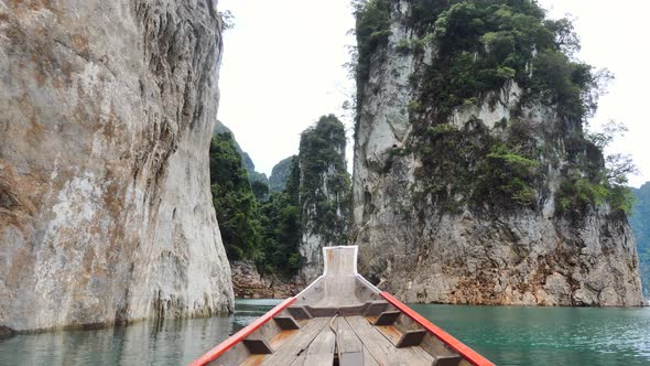 View From Long Tail Boat of Beautiful Limestone Mountains and Tropical Trees