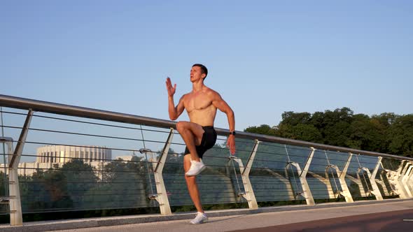 Slow Motion of Jogging in Place of Energetic Muscular Man Outdoor Motivation