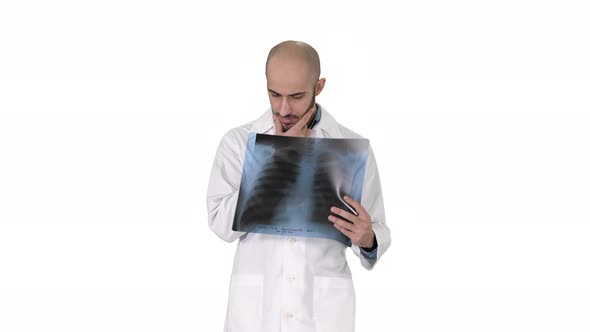 Doctor Radiologist Looking at X-ray Scan Walking on White Background.