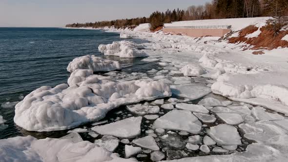 Snowy And Icy Coast In Minnesota During Winter - aerial shot