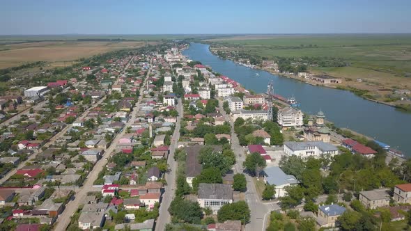 Aerial View Of Sulina City Harbor And The Danube Flowing Into The Black Sea