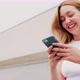 Young woman outdoor using smartphone laughing - VideoHive Item for Sale