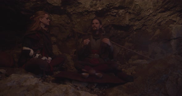 Nomadic Couple Drinking Tea Made In Cave