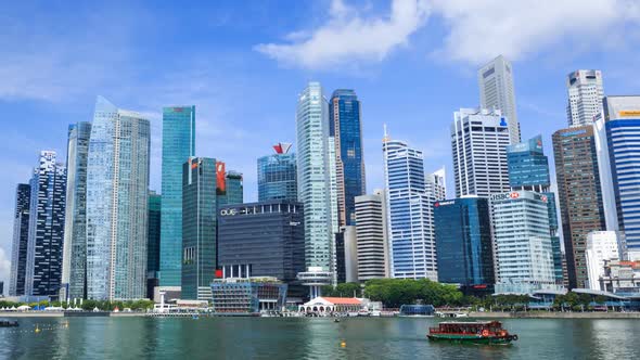 Time-lapse of view of central business district building of Singapore city with blue sky