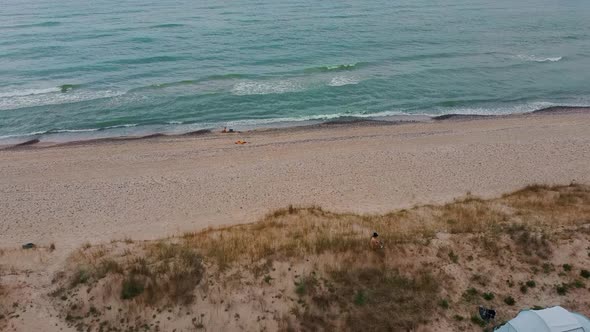 Aerial Dron Shot of the Baltic Sea Uzava, Latvia Costline With Waves View From Above. Tent in Dunes.