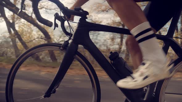 Cyclist Legs. Athlete Cyclist Fit Legs.Cyclist On Bike Cycling And Pedaling Sport Recreation