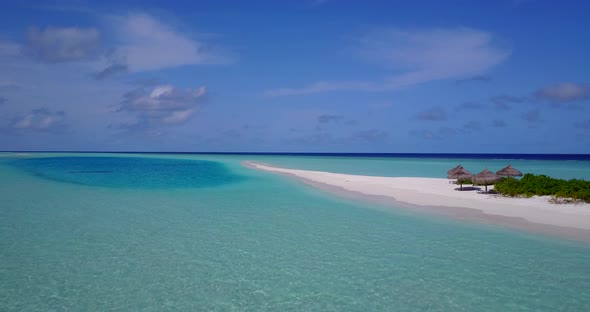 Luxury drone tourism shot of a summer white paradise sand beach and blue sea background in high reso