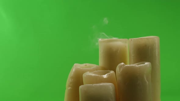 Burning Wax Candles on Green Chroma Key Background