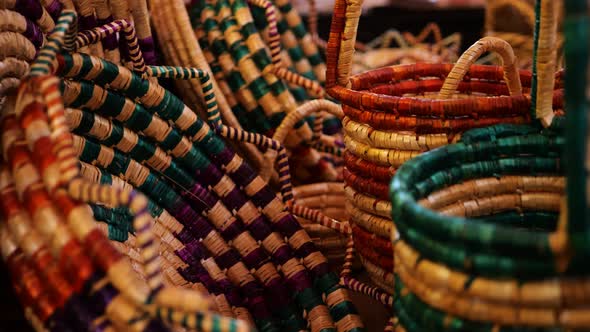 Close Up View Of Colourful Hand Woven Wicker Baskets On Sale In Market Bazaar