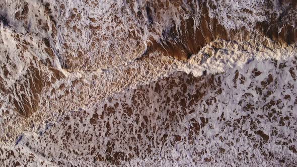 Aerial Birds Eye View Over Rough Sea Waves Breaking At Katwijk aan Zee. Slow Motion