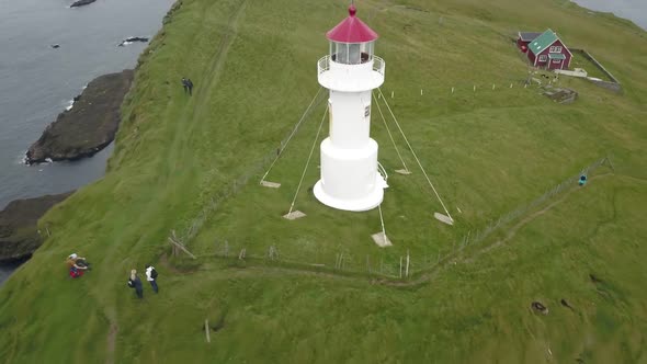 White Beacon on the Top of Cliffs on the Shores