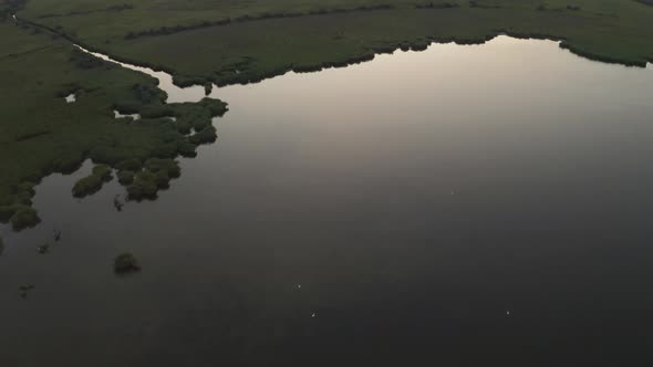 Drone Flight Over Floodplain To Sea Coast at Dusk