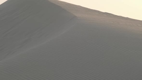 Sand Dunes in the Desert of Dubai During the Wind