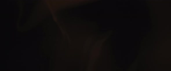 Beautiful incense smoke swirling on black background alt