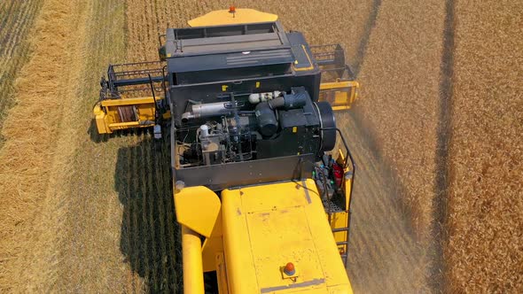 Combine harvester in action on the field.