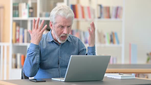 Sad Old Man Having Failure on Laptop