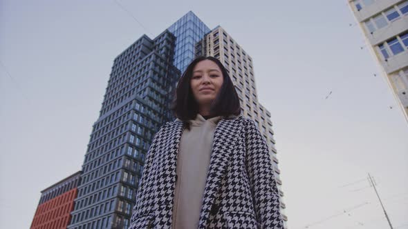 Lowangle Portrait of a Young Adult Asian Woman in Downtown District