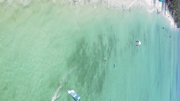 Zanzibar Tanzania  Vertical Video Kitesurfing Near the Shore of Ocean Slow Motion