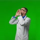 Bearded Doctor Wearing Stethoscope Puts His Hand to His Mouth and Shouts Over Isolated Green - VideoHive Item for Sale