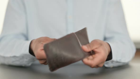 African Man Checking Empty Wallet Close Up