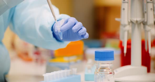 Scientist Making Experiment in Laboratory