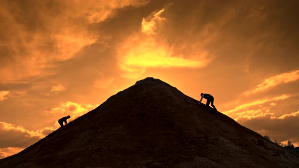 Two Silhouettes Compete in a Mountain Climb