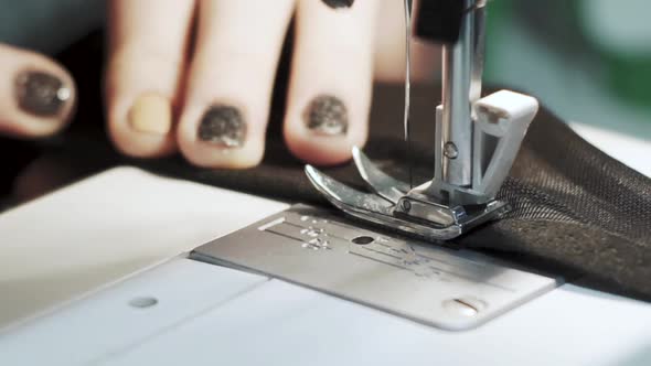 Close Up Shot of Female Hands Working on Sewing Machine