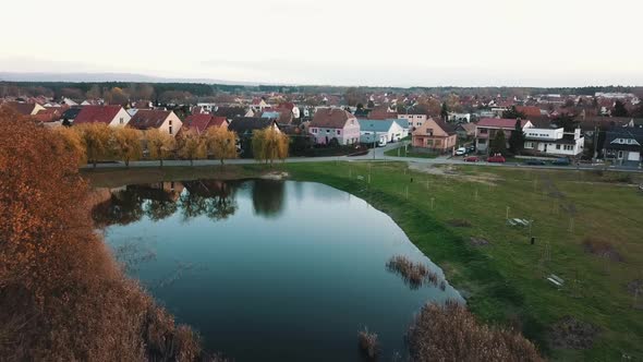 Autumnal Trees Near Small Pond And Beautiful Houses In South Moravian Region, Czech Republic. - aeri