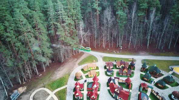 Park in Forest With Wooden Statues of Gnomes, Monsters.  Aerial View of the Wooden Castle 4K Video